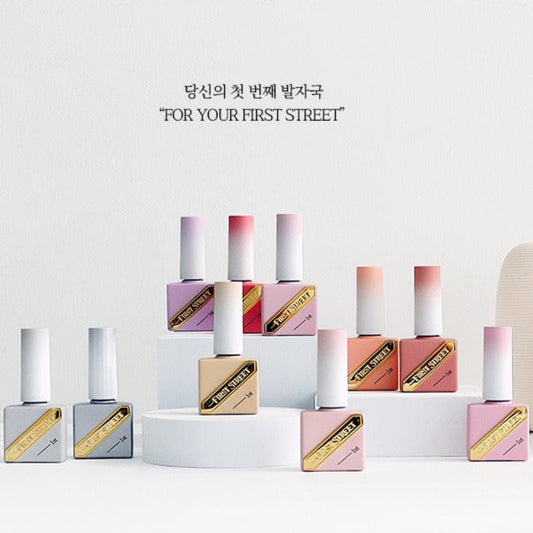 Set of nail polish bottles on a white surface with 'First Street' branding.