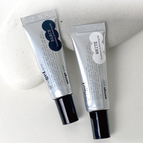Two tubes of gel, one labeled 'Black' and the other 'White', on a light background.