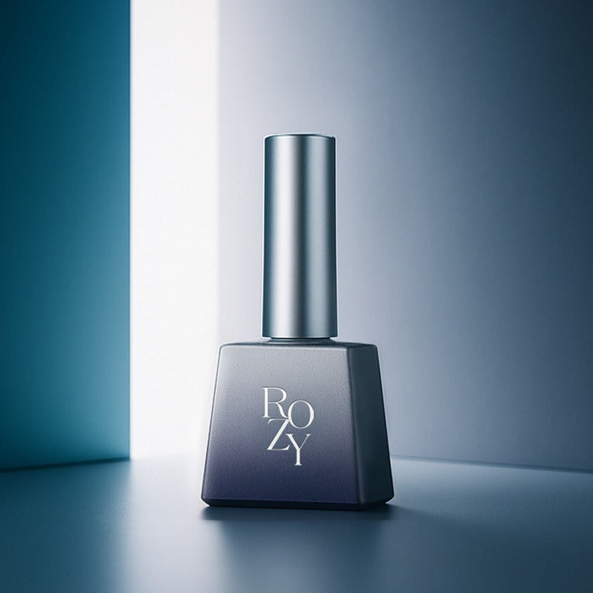 Nail polish bottle with 'ROZY' branding on a gradient blue background